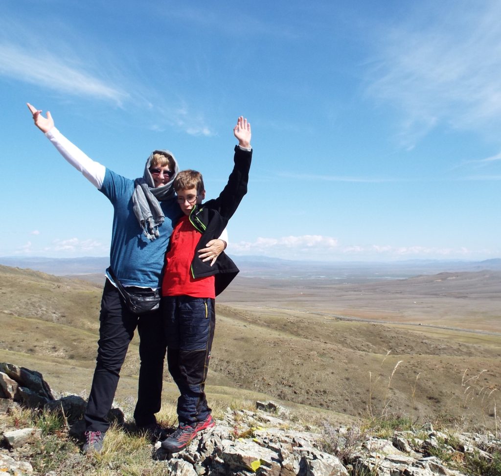 The authors of Moving Mountain Daily on the summit of a mountain in Mongolia. 