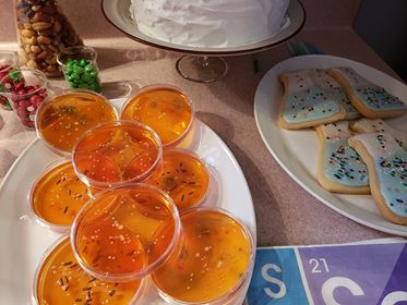 Our Atomic Party yummies included petri dishes with Jell-o and cut out cookies in the shape of chemistry beakers.