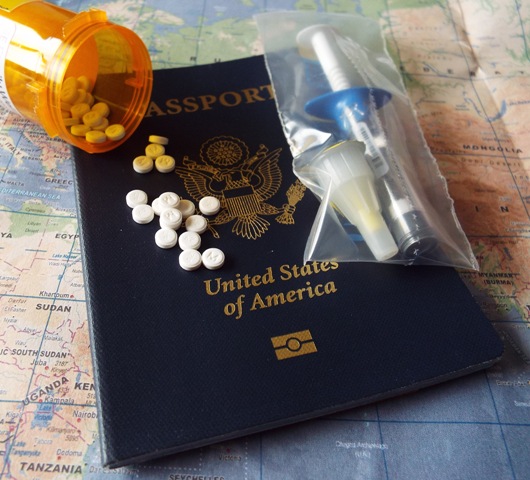 Ready to travel with passport, prescription and syringes.