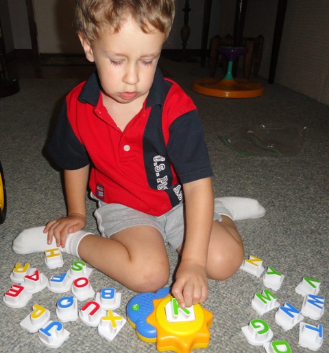 Andrew learning the sounds of each letter.