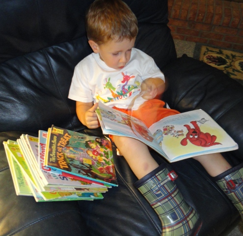 Andrew learning to read with his 'reading' boots on the wrong feet.