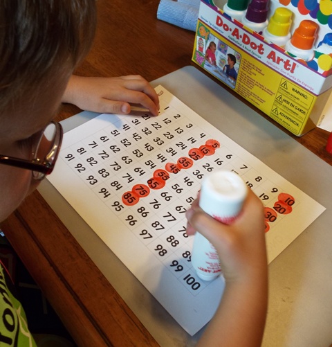 Boy practicing skip counting for math fluency.