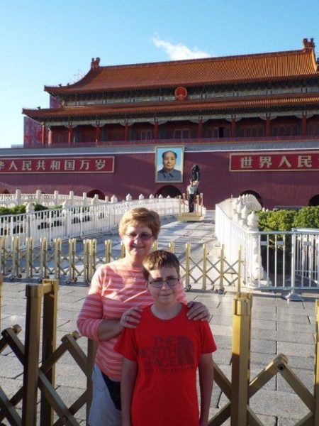 Mom and son in front of the Forbidden City.