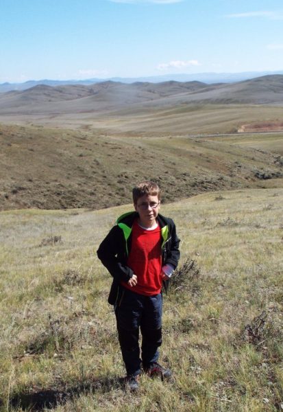 Encounters on the steppe, boy hiking Mongolia outback