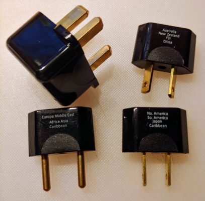 Four different travel adapters.