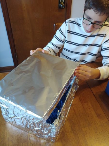 Boy created a Faraday Box for science lab.