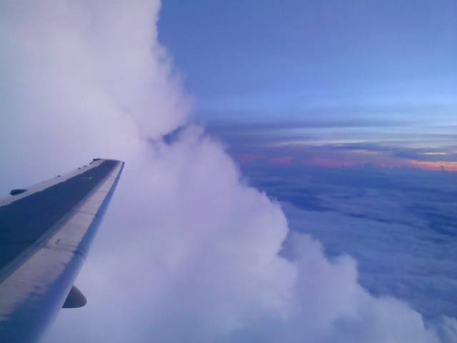 Airplane wing and storm cloud