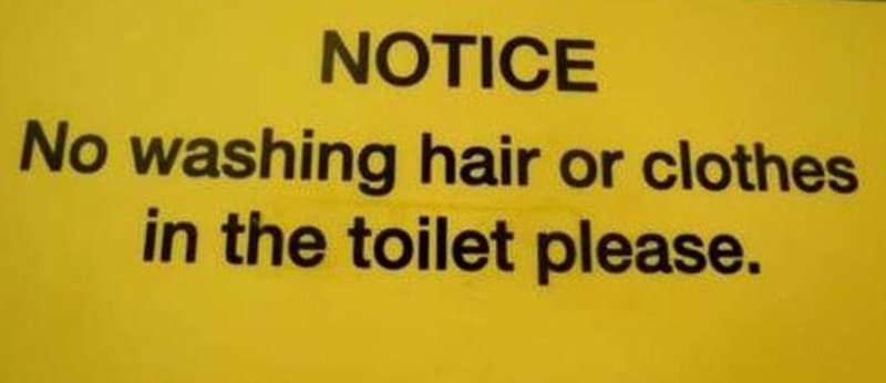 Sign states to not wash hair or clothes in the toilet.