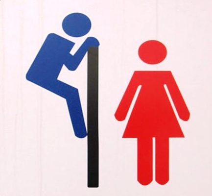 South Korean restroom sign warning about peeping over the wall.