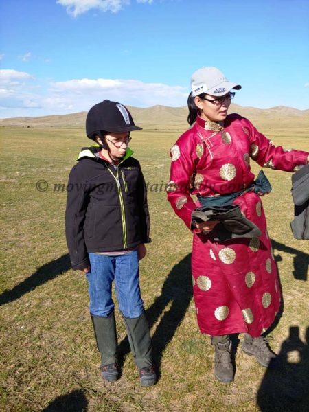 Preparing to go horseback riding in Mongolia