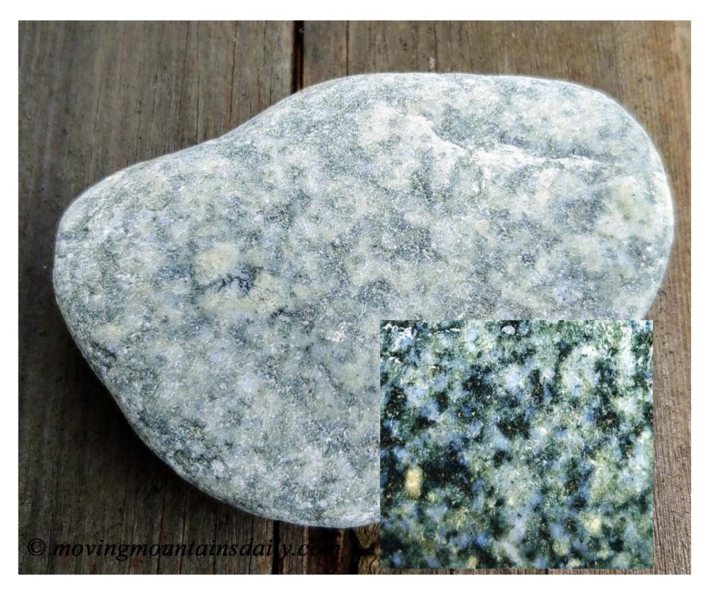 Light colored granite stone with a zoomed section showing minerals.