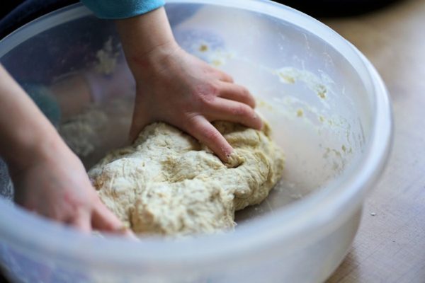 Little hands kneading dough