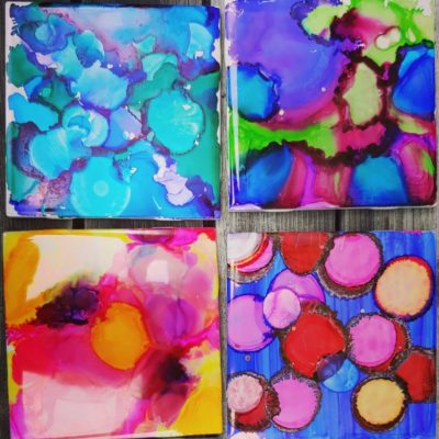 Colorful coasters made with alcohol ink.